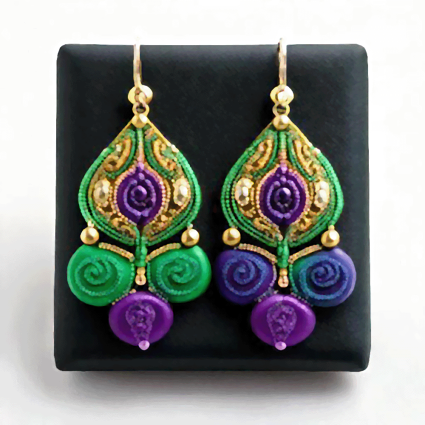 Mardi Gras earrings with purple, green and gold swirl designs.